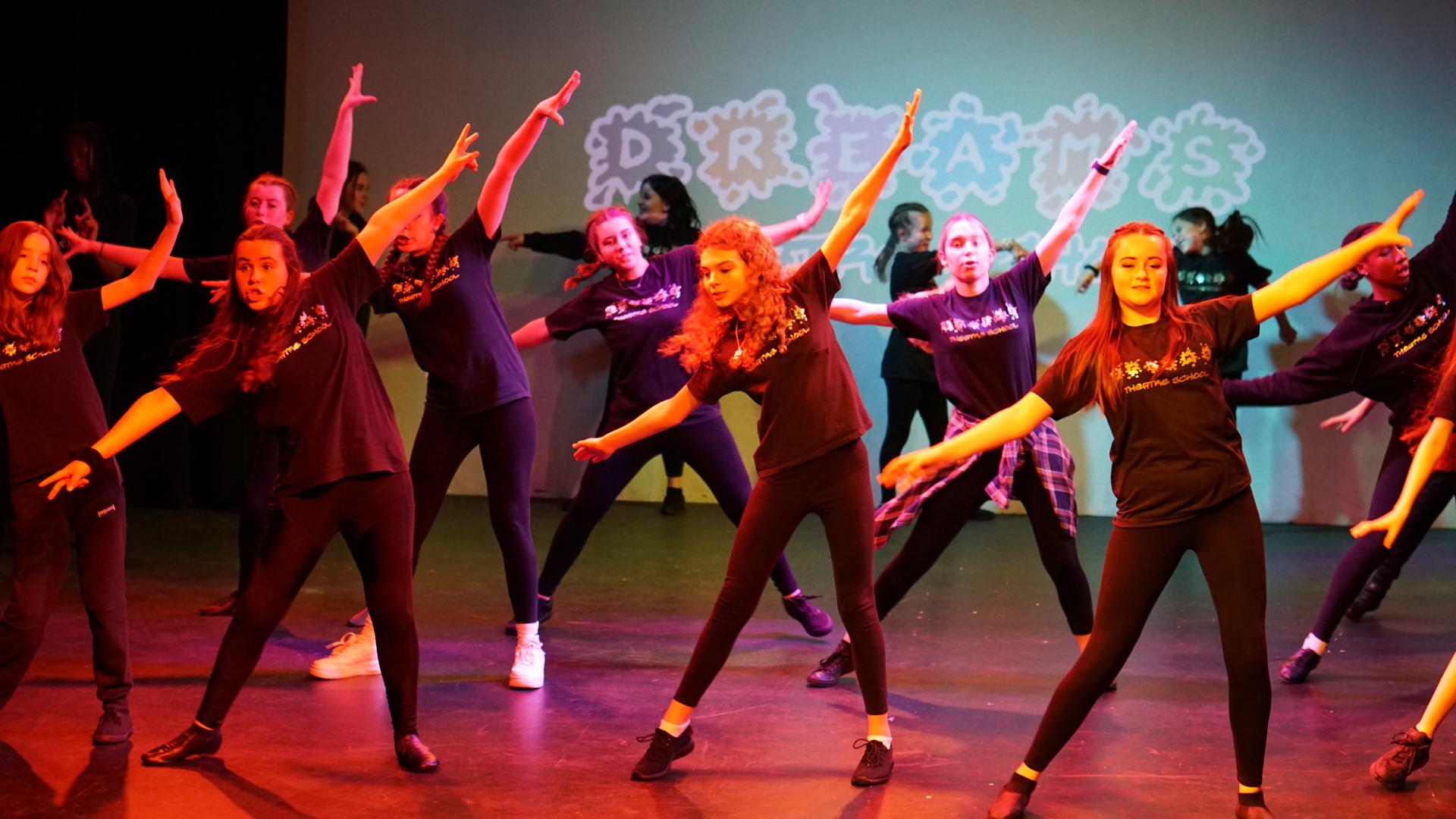 Dreams students performing an energetic dance routine
